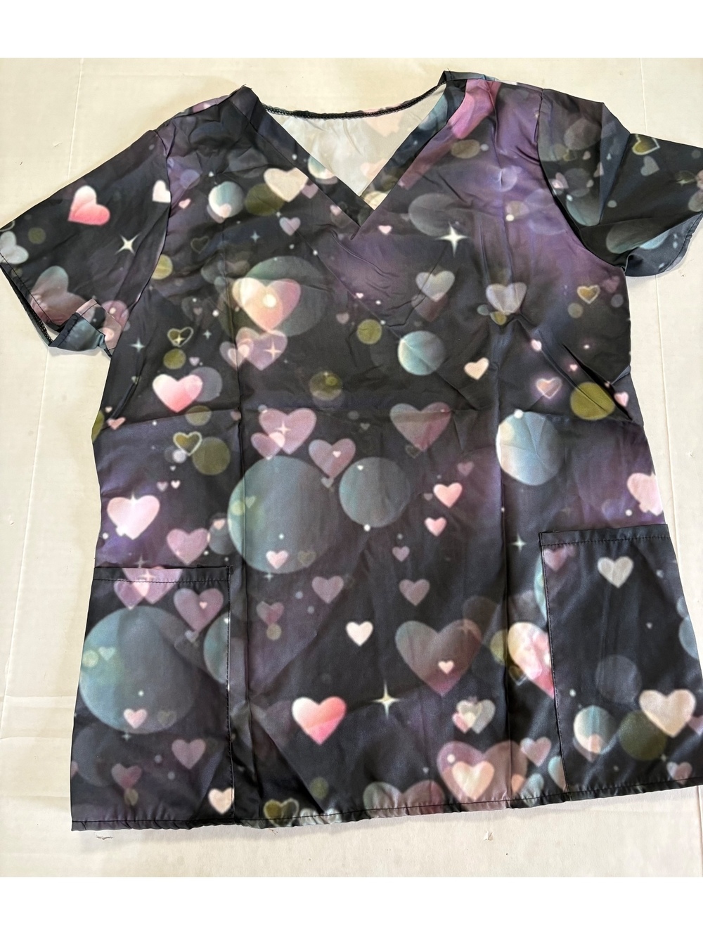 Woman’s heart shaped scrub like shirt with two pockets
